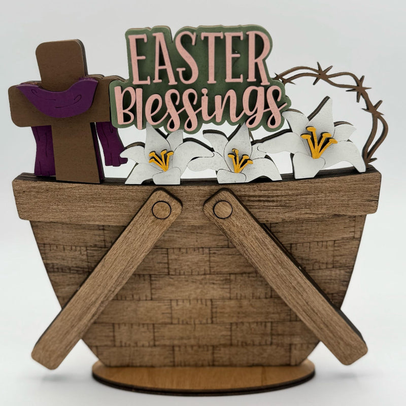 Decorative Easter basket with 'Easter Blessings' sign, cross, and lilies on a white background