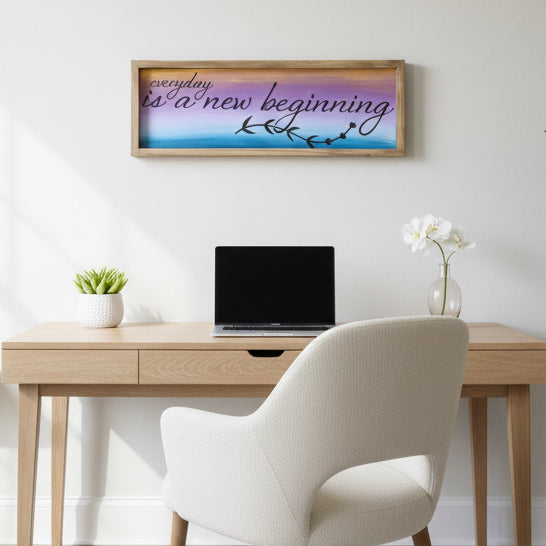 Decorative sign with 'everyday is a new beginning' text on a textured surface