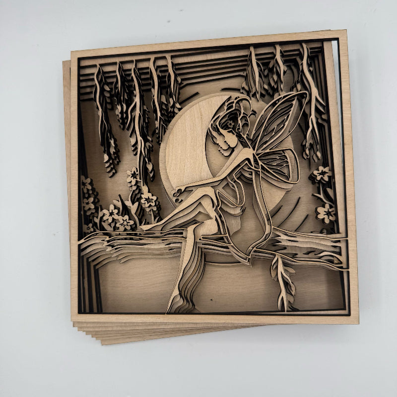 Wooden cutout of a fairy in a natural setting on a white background