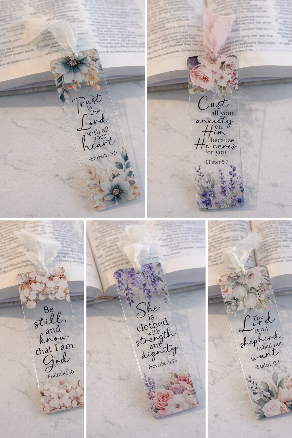 Set of floral bookmarks with inspirational quotes on a book background