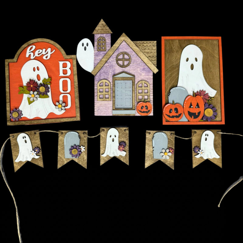 Halloween-themed decorations including ghost signs and banners on a black background