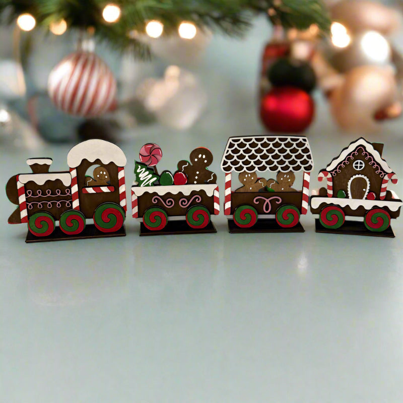 Gingerbread train set on a marble surface with a light blue background