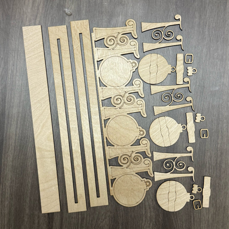 Wooden decorative pieces on a wooden surface