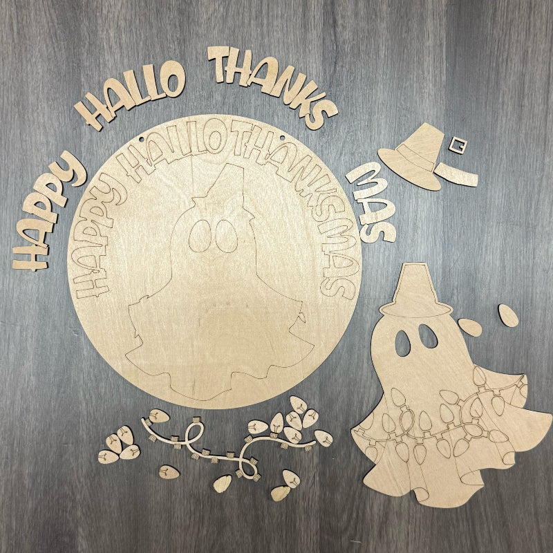 Wooden Halloween decorations with ghost, text, and witch hat on a wooden background