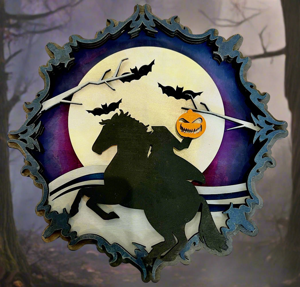 Decorative wall art with a horse, pumpkin, and bats against a moonlit sky on a textured surface.