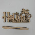 Laser-cut wooden sign reading 'Holidays at the Beach' with palm tree, star, and sand dollar motifs, shown on a white background with a small wooden piece below.