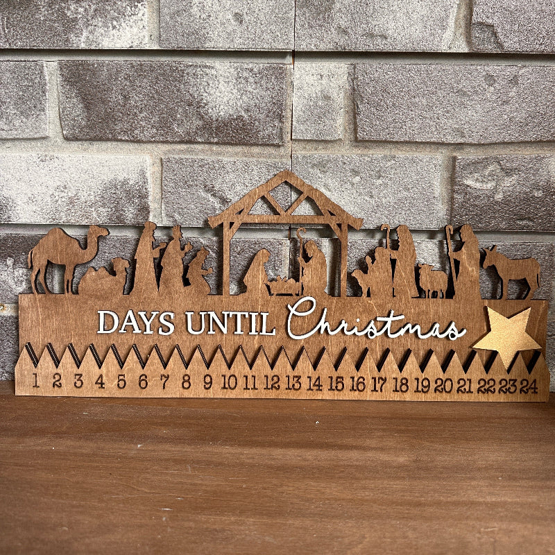 A wooden countdown to Christmas nativity scene with numbers from 1 to 24, and the text 'Days until Christmas'.