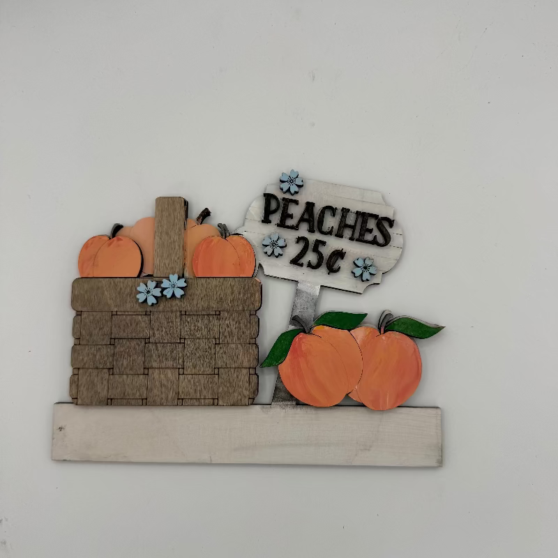 Decorative sign with peaches and a basket on a white background