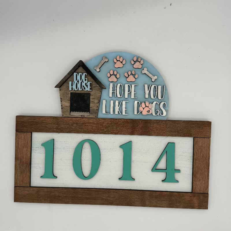 Decorative sign with dog house, paw prints, bones, and house numbers on a white background