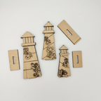 Wooden lighthouse decorations with intricate designs on a white background