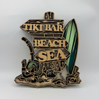 Decorative sign with 'Tiki Bar', 'Beach', and 'Sea' text, featuring a surfboard and beach chair on a white background.