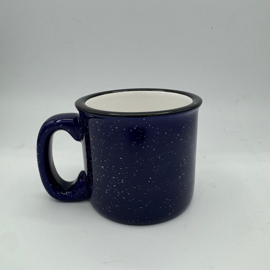 Blue speckled mug with a white interior on a light gray background