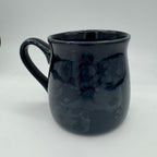 Black ceramic mug on a white background