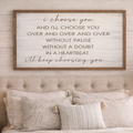 Bedroom with a motivational quote sign above the bed