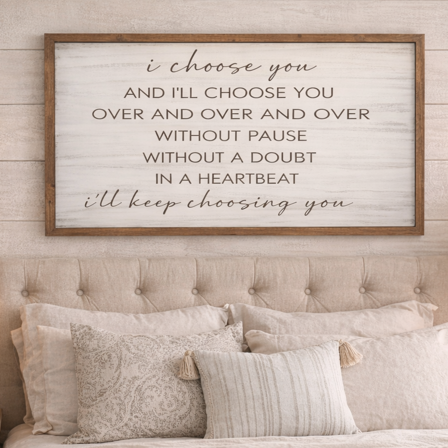 Bedroom with a motivational quote sign above the bed