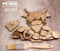 Wooden DIY kit with laser-cut pieces and a paintbrush on a wooden surface, featuring Paisley Grace Design branding.