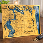 Wooden map of Jacksonville, Florida on a wooden surface with keys in the foreground.  Epoxy Workshop Option at Paisley Grace Makery DIY Workshop in Fernandina Beach. 