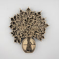 Laser-cut wooden wall art featuring layered maple leaves in a vase, shown against a plain light gray background.