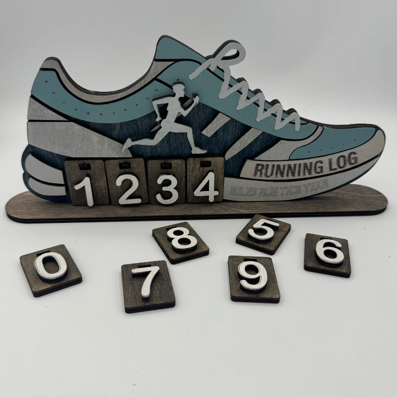 Wooden running log with shoe design and number blocks on a white background