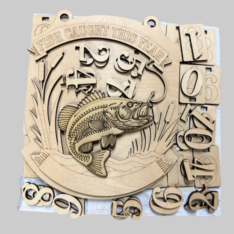 Wooden plaque with fish engraving and numbers, held by a person.