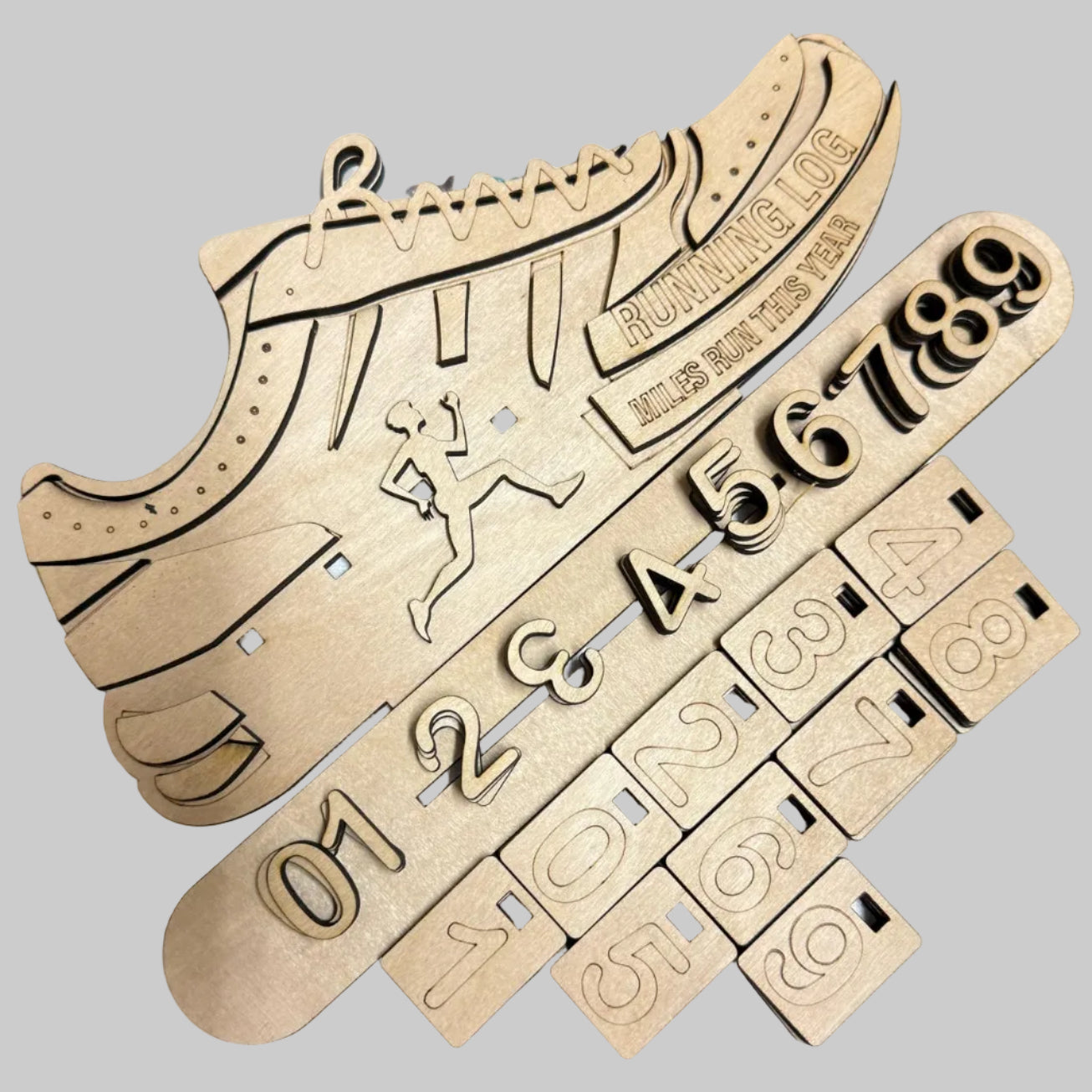 Wooden shoe-shaped puzzle with numbers on a white surface