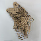 Wooden laser-cut map of a city on a white background