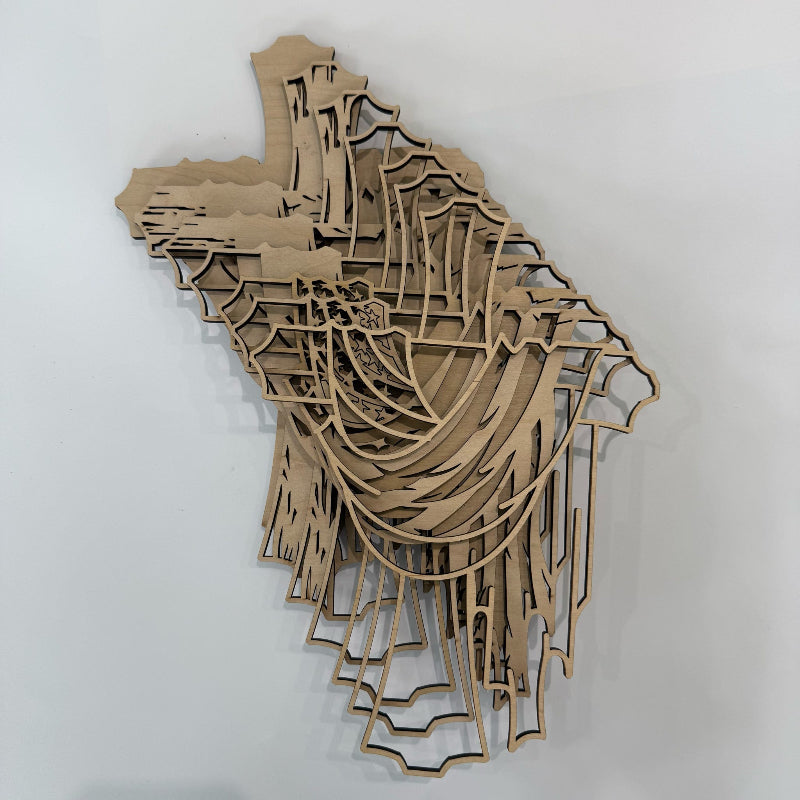 Wooden laser-cut map of a city on a white background