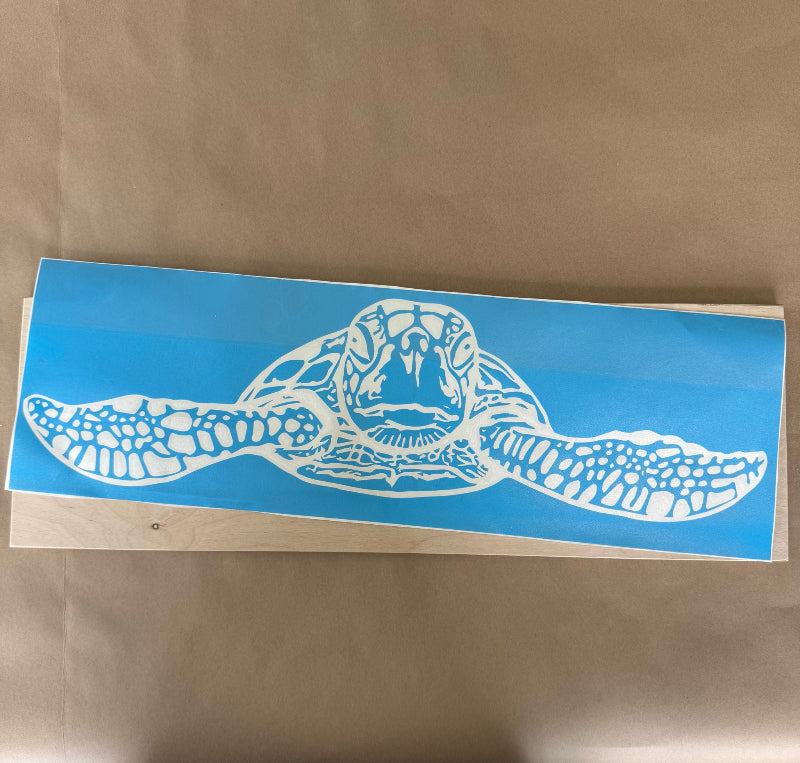 White turtle decal on a blue background