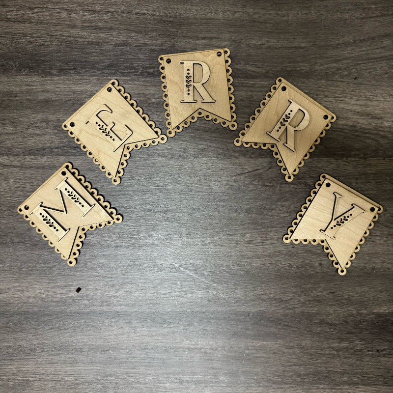 Set of wooden letter coasters with 'R', 'Y', and 'M' on a wooden surface