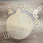 Wooden Christmas ornament with 'Merry Christmas' text on a wooden background