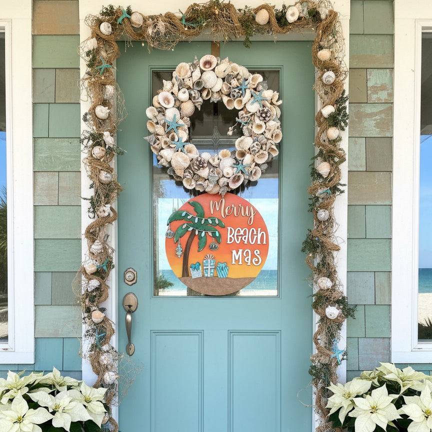Decorative wreath with shells and garland on a teal door with a 'Merry Beach Mas' sign.
