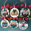 Set of Christmas ornaments with festive designs on a green background