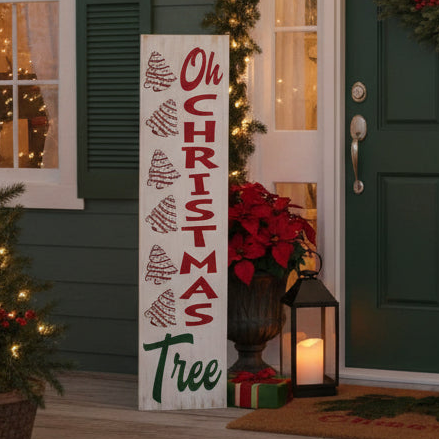 Decorative Christmas sign with 'Oh Christmas Tree' text on a porch with festive decorations.