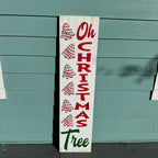 Wooden Christmas sign with 'Oh Christmas Tree' text and tree illustrations against a teal wooden background.