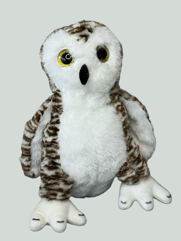Plush owl toy with white and brown feathers on a gray background