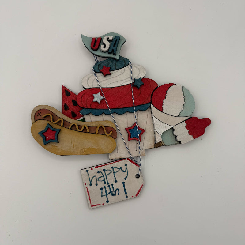 Decorative item with 'USA' and 'Happy 4th!' text on a white background