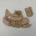 Wooden puzzle piece with cut-out shapes on a white background