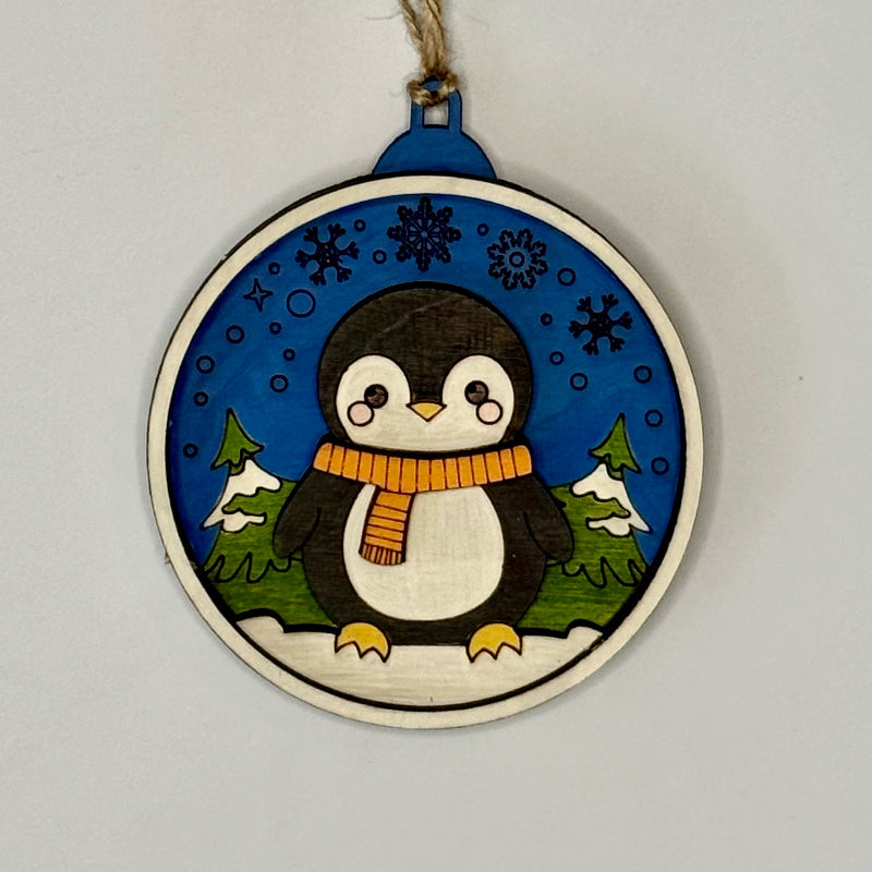 Decorative ornament with a penguin design on a plain background