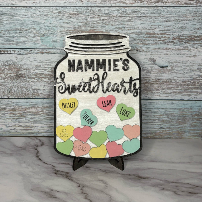 A personalizable sweethearts jar sign with a white background, featuring a jar with hearts and customizable text for names.