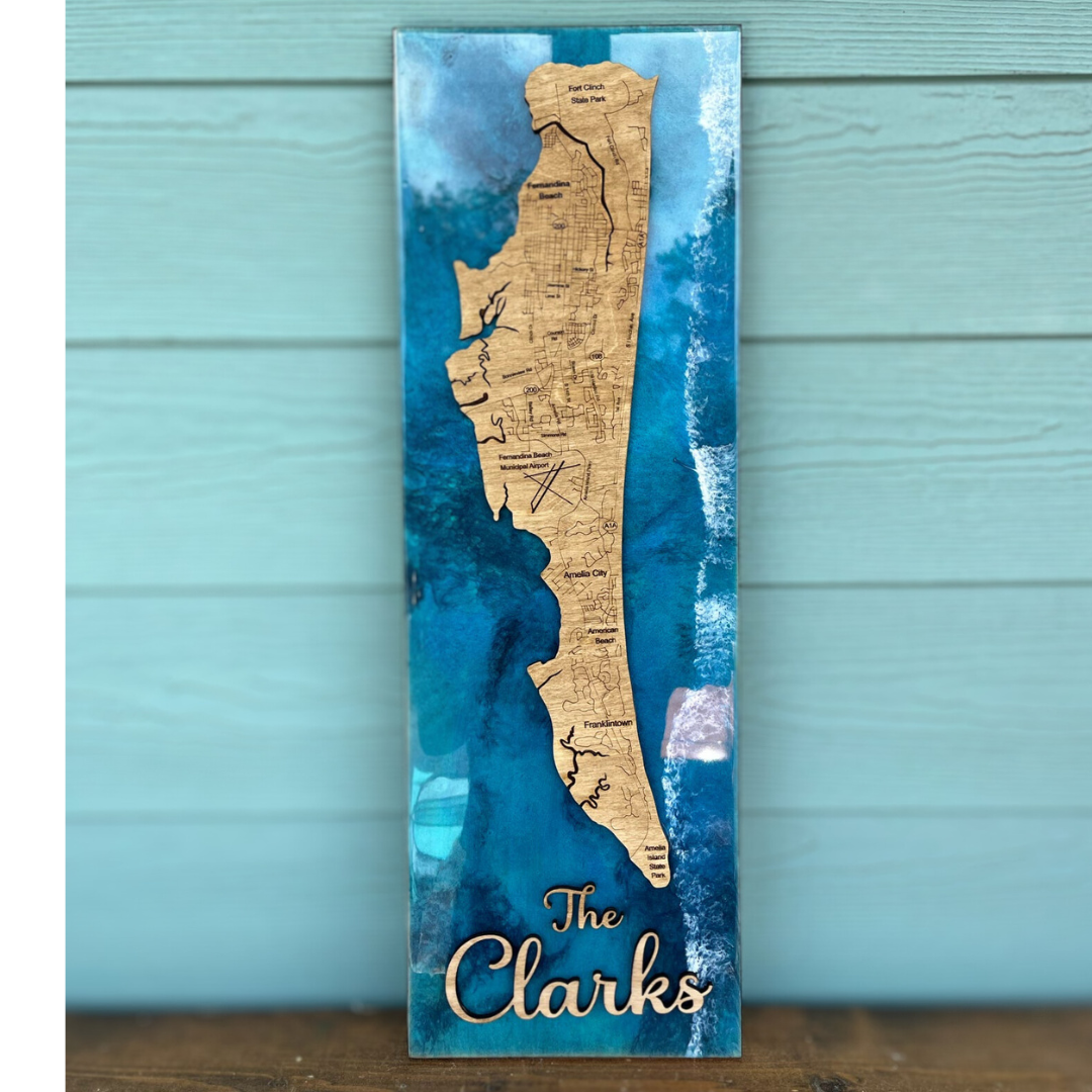 A personalized epoxy workshop item with a blue background, gold geometric shapes, and personalized text 'The Clarks'.