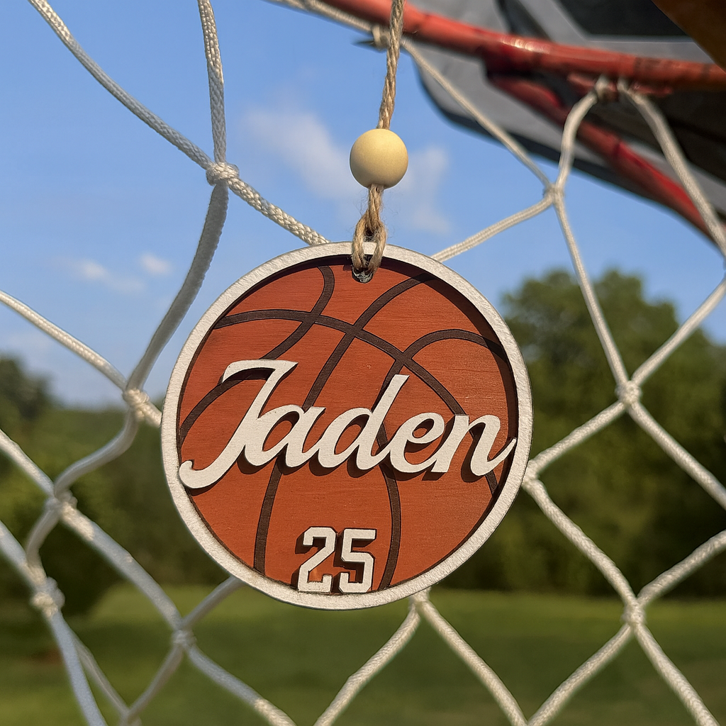 Basketball-themed ornament with 'Jaden' and number '25' hanging on a basketball net