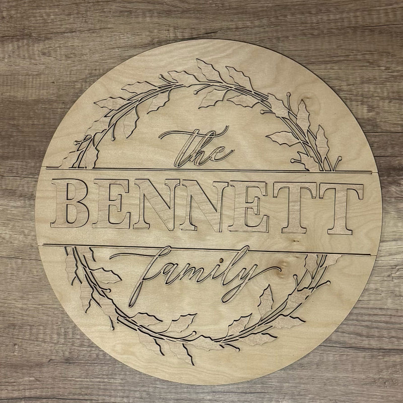 Wooden circular sign with 'The Bennett Family' engraving on a wooden background