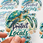 Sticker of a turtle with 'Protect the Locals' text held by a hand, with more stickers in the background.