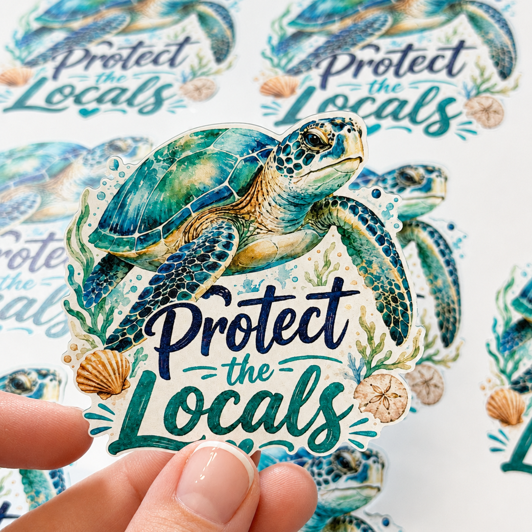 Sticker of a turtle with 'Protect the Locals' text held by a hand, with more stickers in the background.
