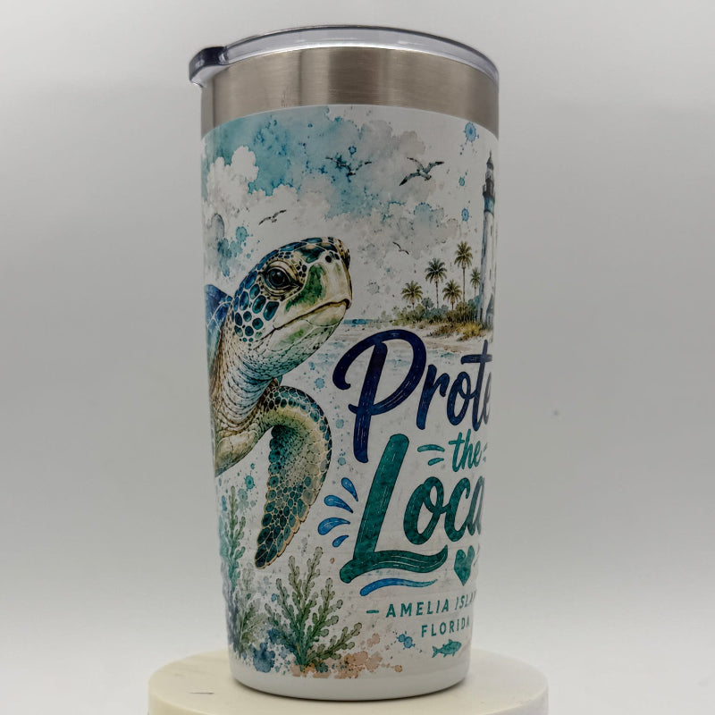 Tumbler with a turtle design and text on a white background
