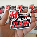 A hand holding a die-cut sticker that reads 'PROUD TO BE A HILLIARD FLASH' with a large red and black 'H' and lightning bolt. Multiple identical stickers are visible on a white sheet in the background.