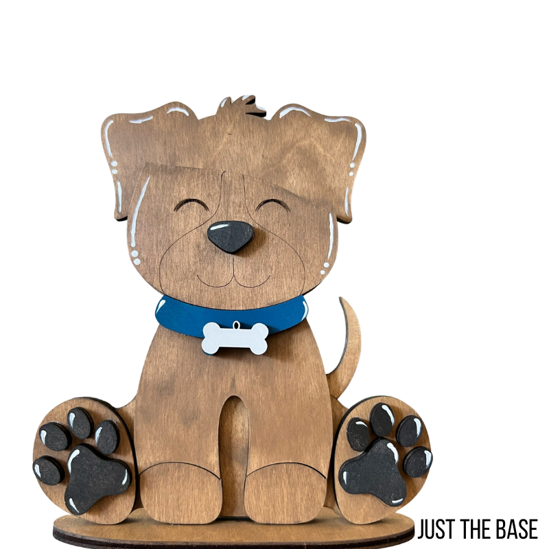Wooden dog figurine with a blue collar on a white background