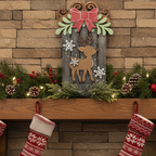 Decorated fireplace with stockings hanging above, surrounded by Christmas decorations.