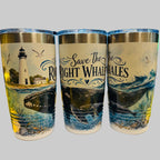 Three tumblers with ocean-themed designs on a desk.