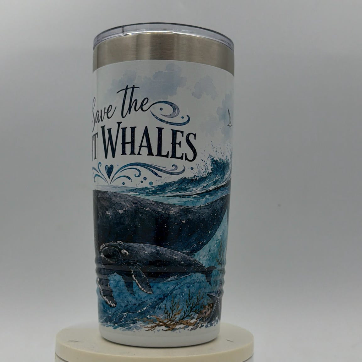 Tumbler with whale design and 'Save the Whales' text on a white background